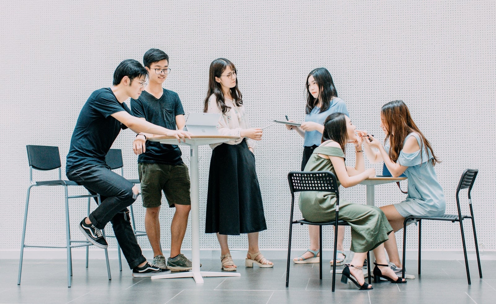 Asian business team collaborating on Microsoft 365 in a modern office